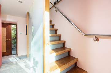 Head upstairs to the first floor living areas.