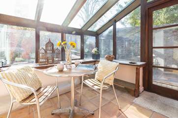 On a rainy day, the conservatory offers a pleasant place to sit.
