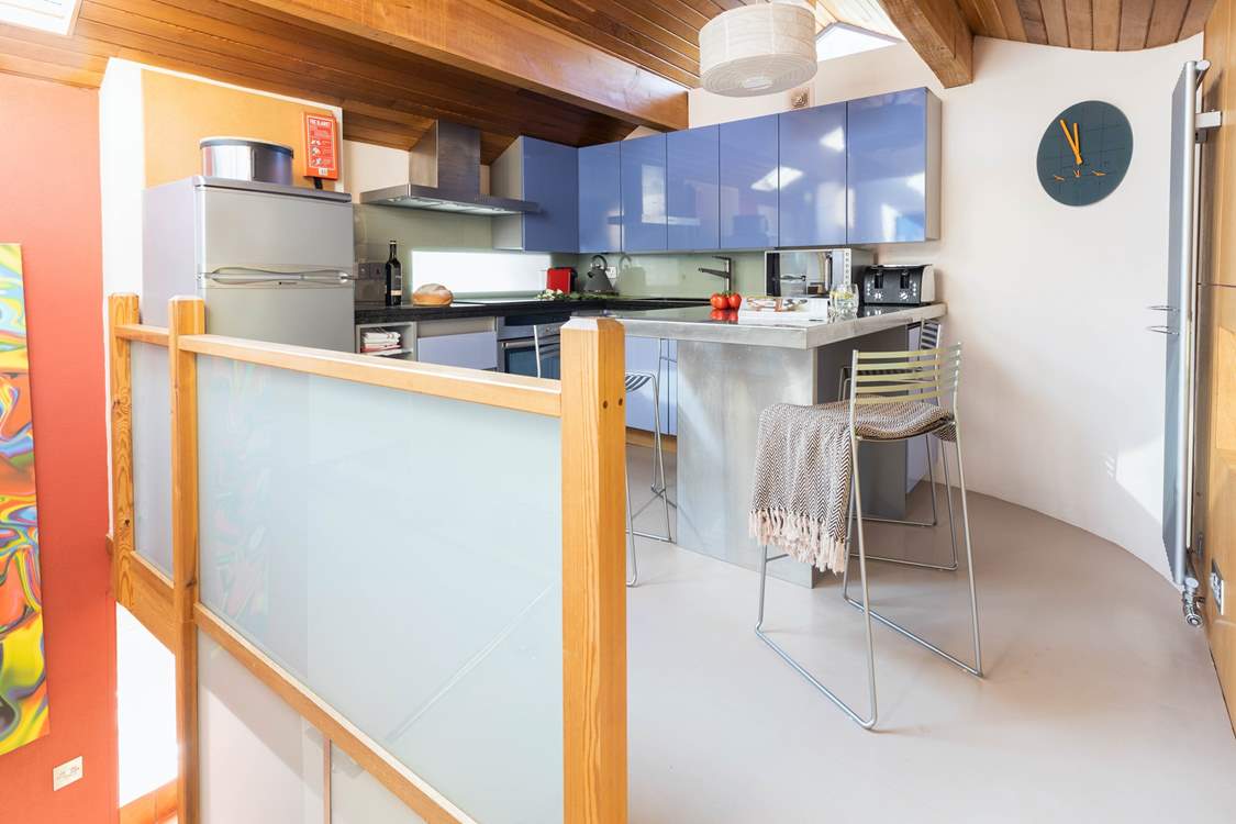 The stairs lead into the kitchen/dining area.
