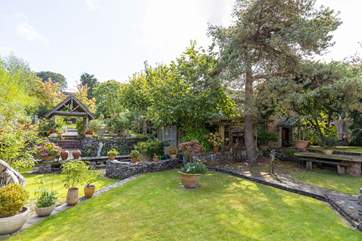 The fabulous Stonewater Barn is romantically tucked away behind the trees.