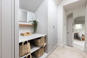 Bedroom three has its very own dressing area with oodles of storage space. Please note the step down into the bedroom area.