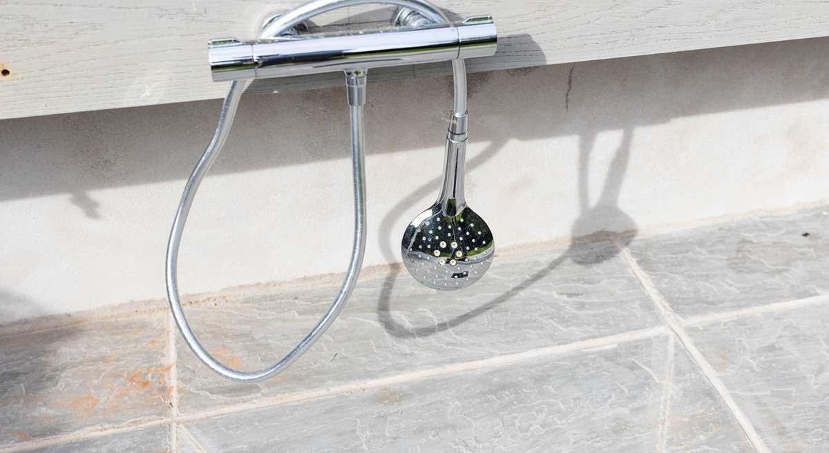 This external warm water shower is perfect for washing down your body boards and wetsuits following a day on the beach.