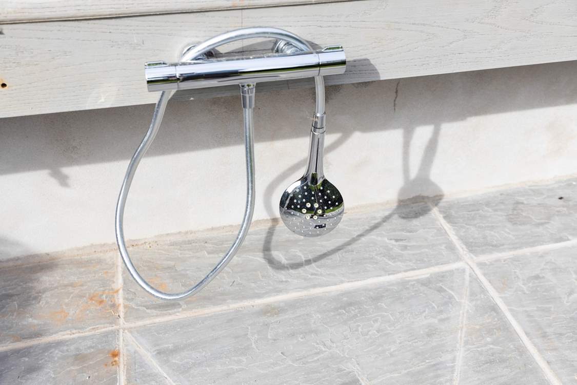 This external warm water shower is perfect for washing down your body boards and wetsuits following a day on the beach.
