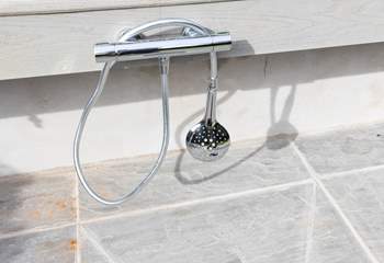 This external warm water shower is perfect for washing down your body boards and wetsuits following a day on the beach.