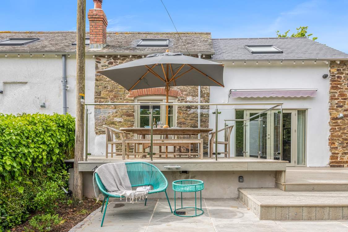 This area is a fabulous sun-trap, which is why it is fully equipped with a huge sunshade for those who wish to escape the sun, yet still enjoy this beautiful outside space.