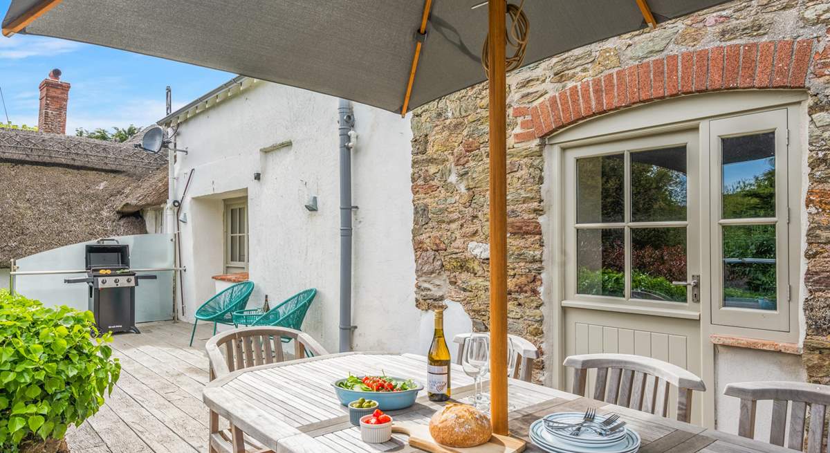 The decked area is perfect for dining together in the sun.