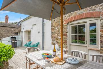 The decked area is perfect for dining together in the sun.