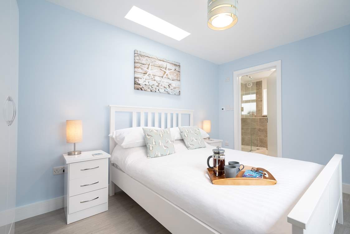 The skylight above the bed has a lovely patterned seal above you.