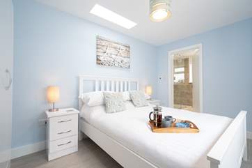 The skylight above the bed has a lovely patterned seal above you.