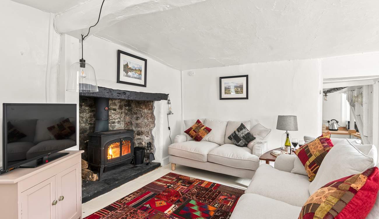 The living-room leads into the kitchen. Please mind the steps down into the kitchen. 
