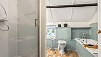 The family bathroom offers you the choice of a refreshing shower or a leisurely soak in the tub.