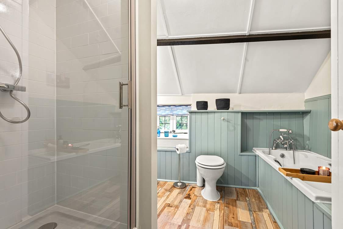 The family bathroom offers you the choice of a refreshing shower or a leisurely soak in the tub.