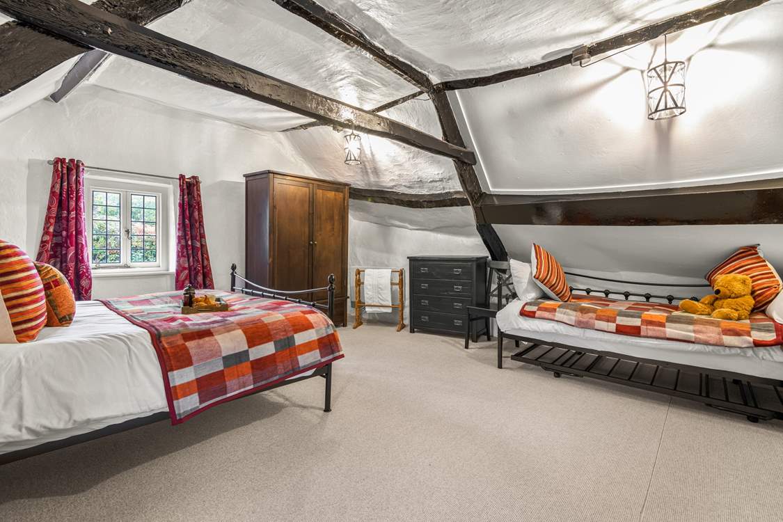 Due to the size of the bedroom, this fabulous cottage can accept a third guest as the daybed turns into a comfy single bed.