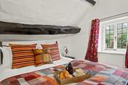 The bedroom is home to this fabulous king-size bed and offers oodles of comfort and space.