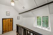 Back in the house, on the first floor, you are greeted by this spacious landing area.