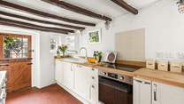 The kitchen leads out into the patio and garden area.