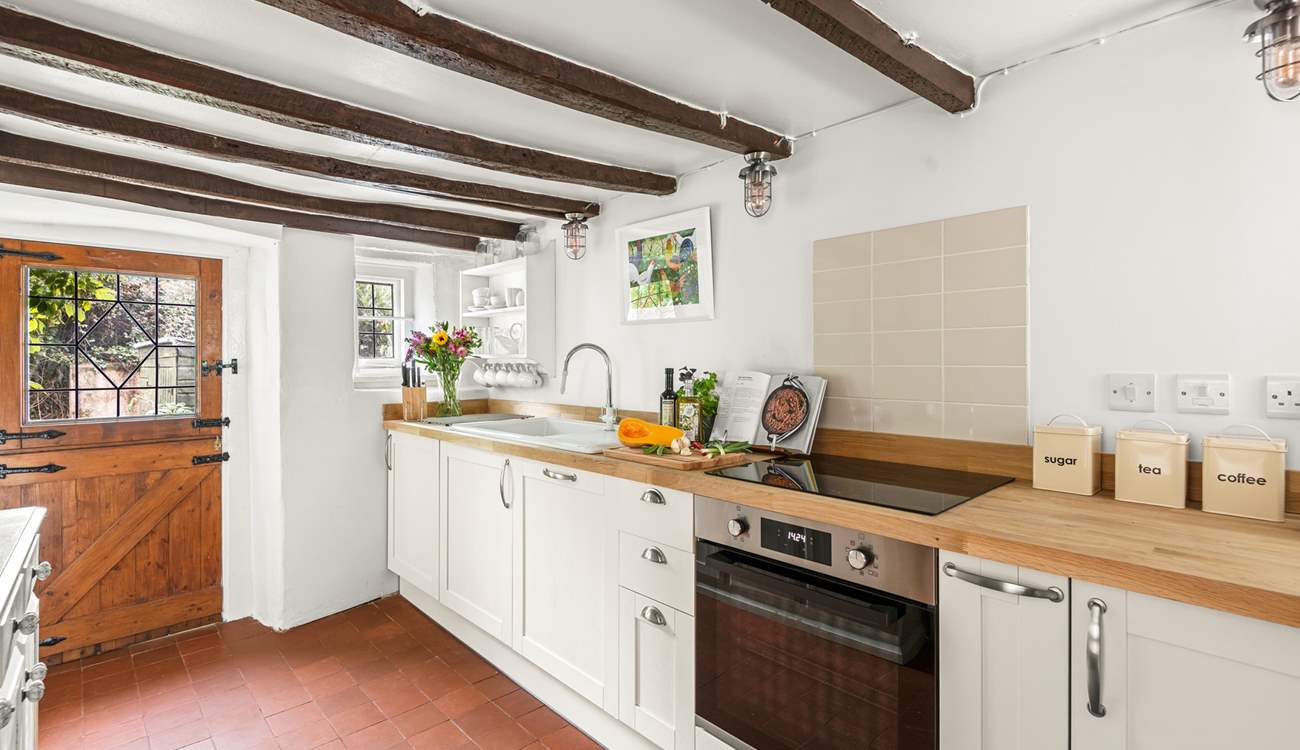 The kitchen leads out into the patio and garden area.