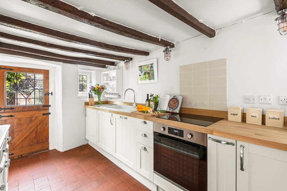 The kitchen leads out into the patio and garden area.