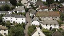 An aerial shot of Holcombe showcases the array of beautiful thatched houses, a pretty central church, and at the heart of the village, the welcoming village pub at the top of the road.