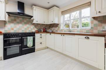 The spacious kitchen is equipped with everything you could need.