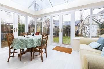 The conservatory offers more seating and dining space.