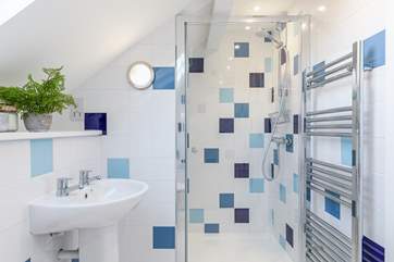 The family bathroom on the first floor has a shower and separate bath.