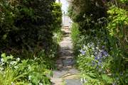 Follow the garden path to the beach lane.