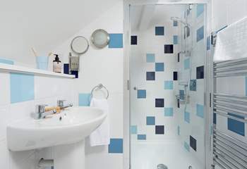 The family bathroom on the first floor has a shower and heated towel rail.