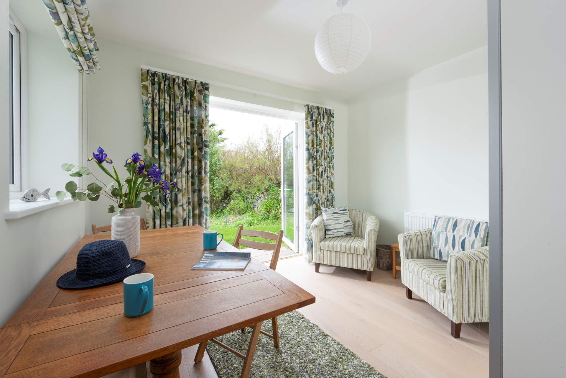 This seating/dining area leads from bedroom 1 and creates a private space.