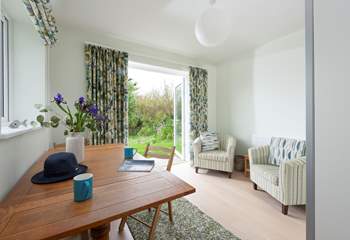 This seating/dining area leads from bedroom 1 and creates a private space.