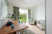 This seating/dining area leads from bedroom 1 and creates a private space.
