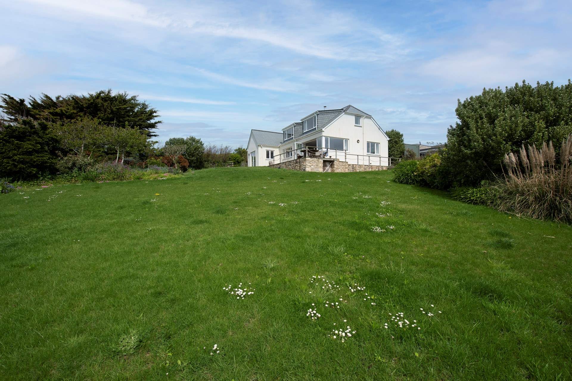 The garden overlooks the ocean, and has direct access to the beach pathway.
