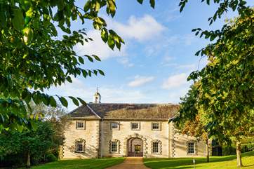 Beautifully renovated coach house located first floor of this stunning building on the right corner overlooking the most stunning setting.
