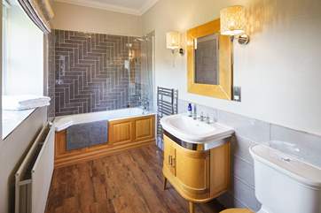 En suite bathroom with views of the grounds.