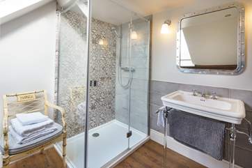 The main bedroom en suite with stunning mosaic tiles and views overlooking the clock tower.