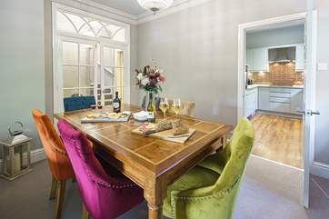 Sit down and enjoy a glass of wine or two over dinner in the vibrant dining-area.