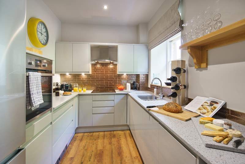 A contemporary kitchen, perfect for cooking up those delights. 