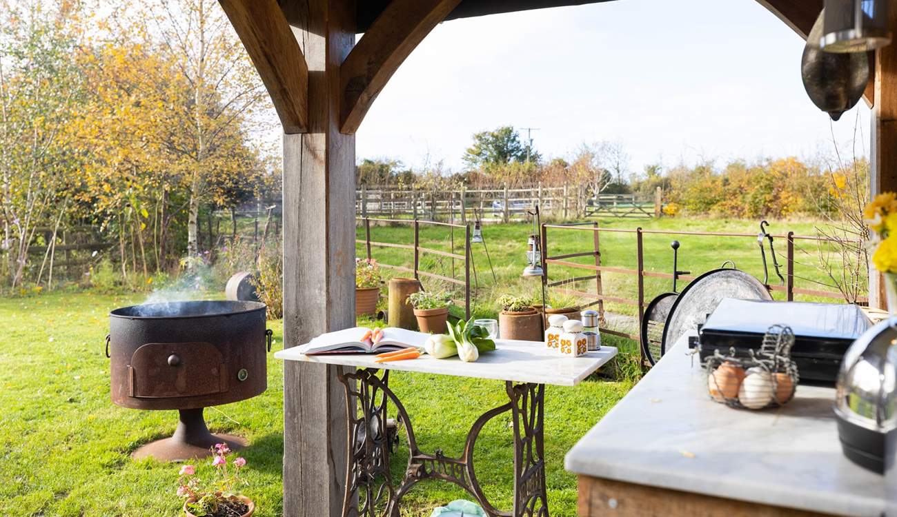 When the sun shines open the sides and enjoy cooking with a view in the rustic kitchen.
