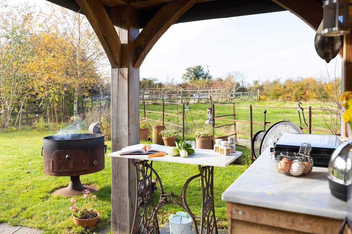 When the sun shines open the sides and enjoy cooking with a view in the rustic kitchen.