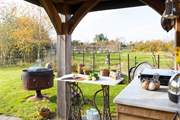 When the sun shines open the sides and enjoy cooking with a view in the rustic kitchen.