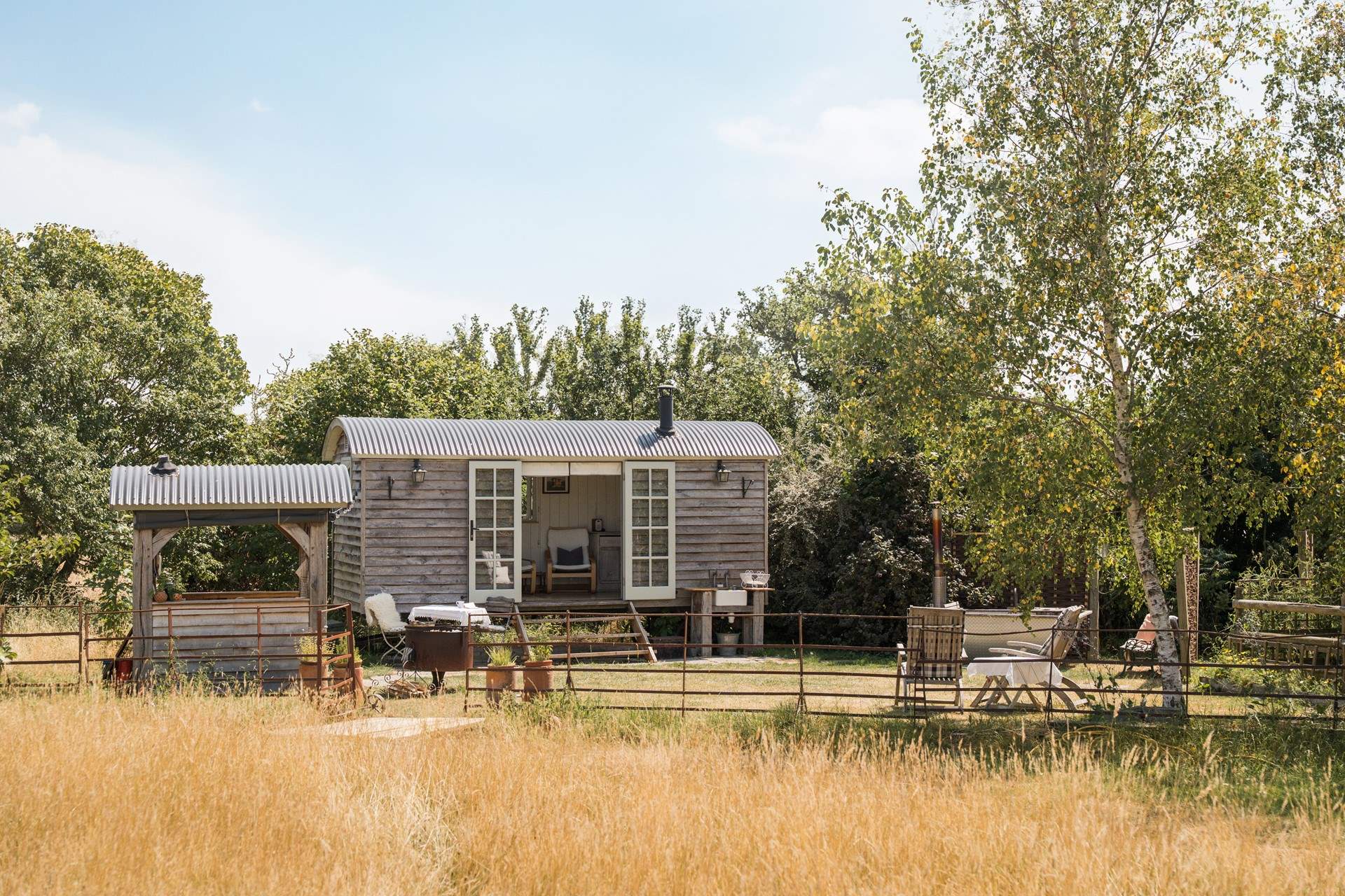Posy - Tucked away in a peaceful corner of the Somerset countryside, Posy is a beautifully crafted shepherd's hut designed for slow mornings, cosy evenings, and uninterrupted time together. From soaking in the wood-fired outdoor bath beneath star-filled skies to cooking over the fire as the sun begins to set, every detail invites you to switch off, embrace nature, and savour life's simpler pleasures.