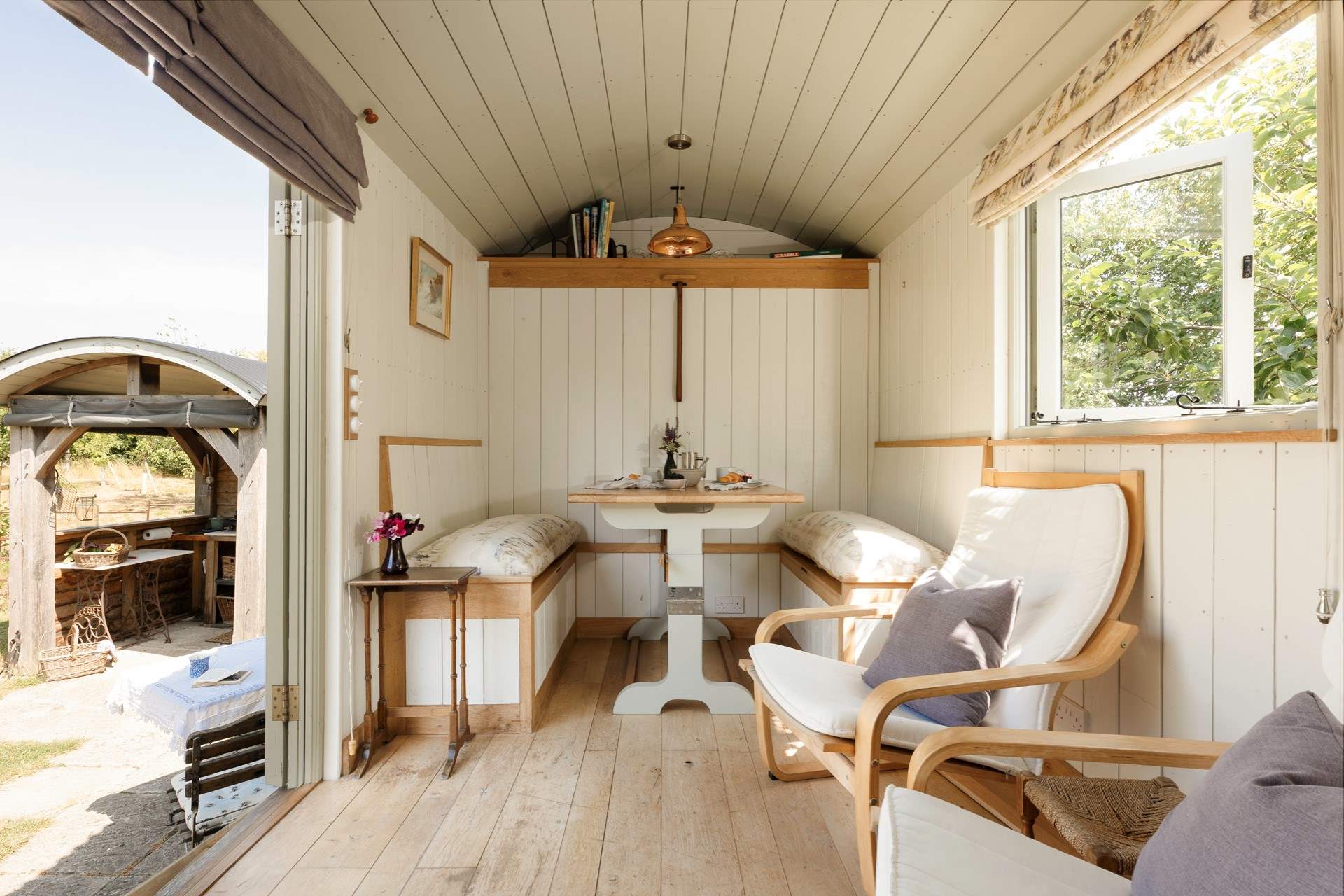 The fold-down table and seating area provide the perfect spot for slow breakfasts or relaxed evening meals.