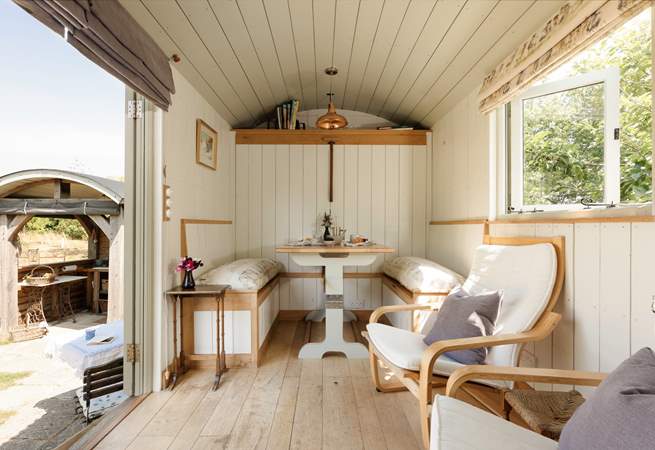 The fold-down table and seating area provide the perfect spot for slow breakfasts or relaxed evening meals.