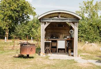 Cleverly designed with pull down sides for cooking during all seasons.
