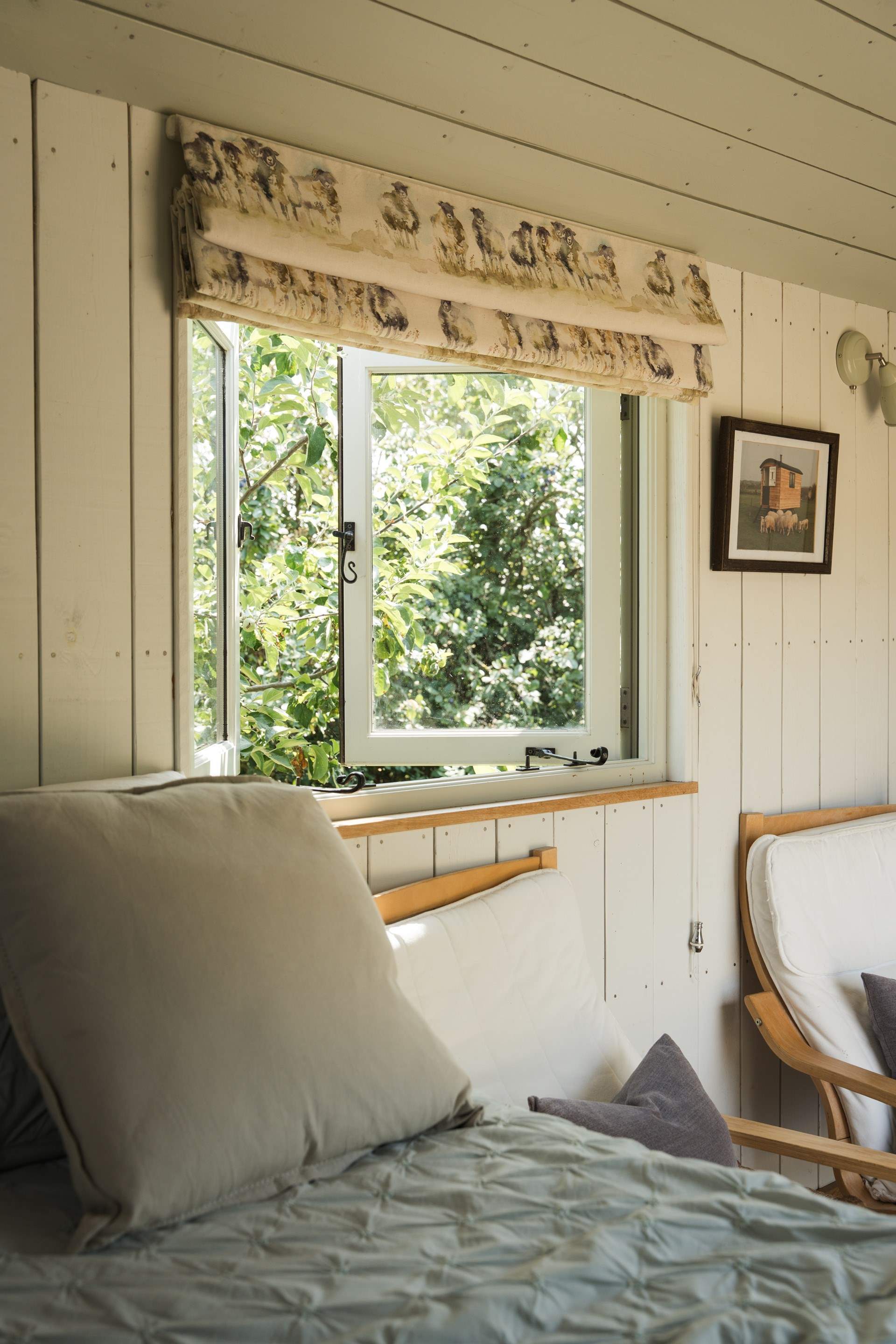 The inviting double bed promises peaceful nights beneath soft linens.