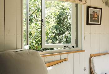 The inviting double bed promises peaceful nights beneath soft linens.