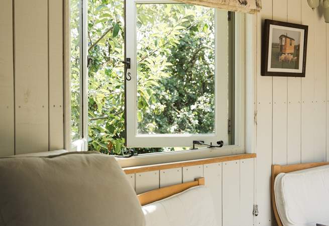 The inviting double bed promises peaceful nights beneath soft linens.