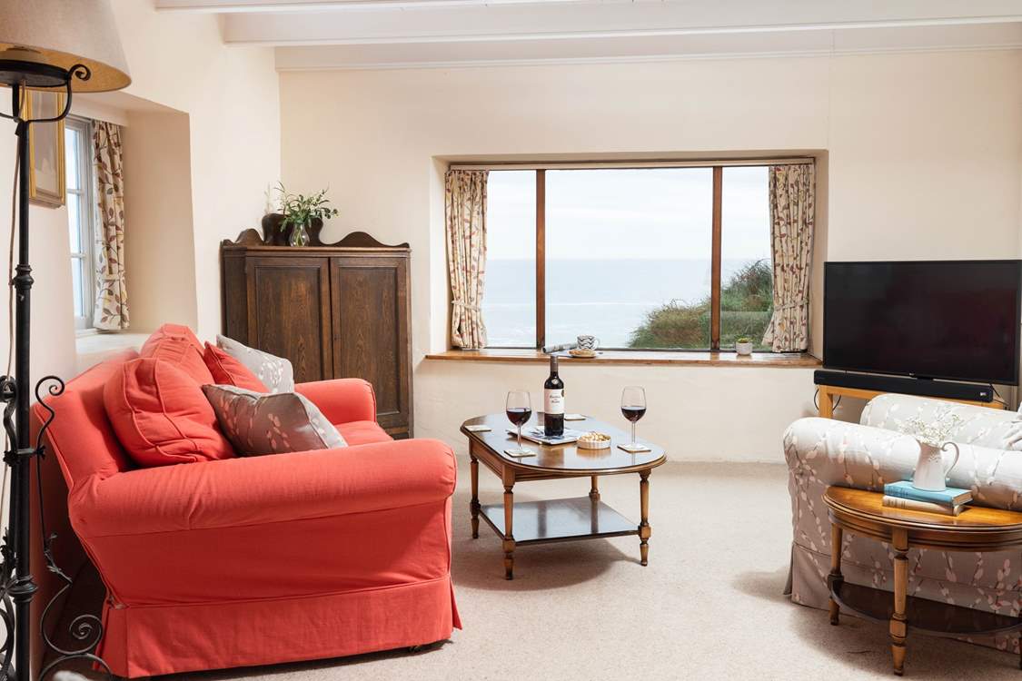 Sit back and relax in the sitting-room and look out to Little Beach, The Todden and the ocean beyond.