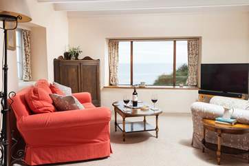 Sit back and relax in the sitting-room and look out to Little Beach, The Todden and the far stretching sea.