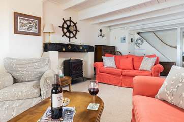 There is plenty of seating so no one misses out on the sea view. Perhaps turn on the electric wood-burner for the cooler evenings.